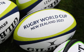 Rugby balls with the RWC New Zealand 2021 logo.