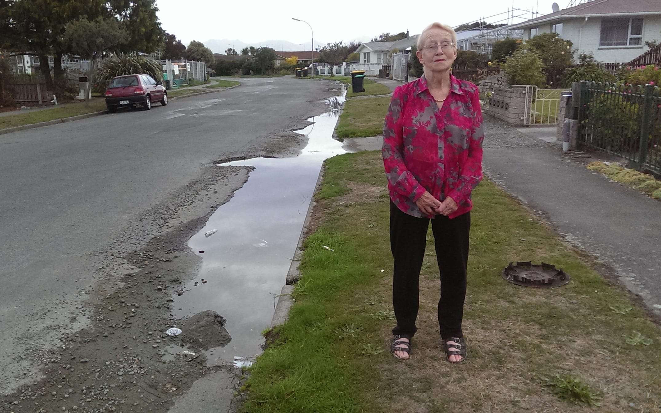 Joyce Fuller's street has had a constant flood of water ever since a spring came up in a neighbour's property in the earthquakes four years ago.