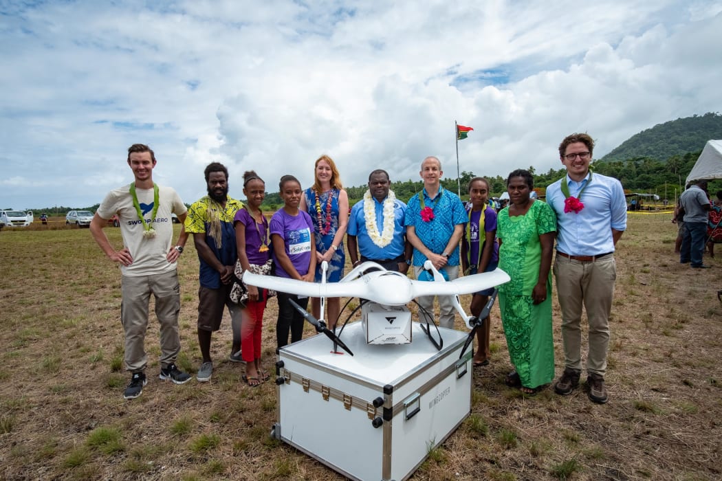 The UNICEF team with the drone on Vanuatu.