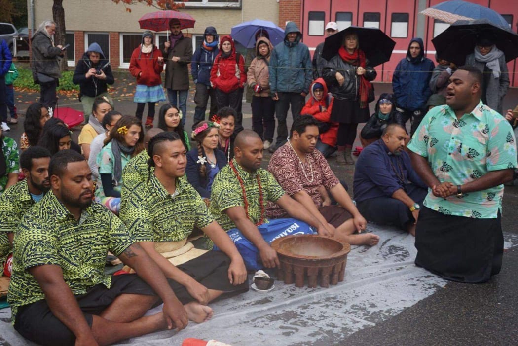 Pacific island climate change campaigners  hold a traditional Fijian sevusevu and offer tapa to a community impacted by a massive coal mine in Germany.