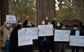 TEHRAN, IRAN - NOVEMBER 28: A group of demonstrator gather to protest gathering against the assassination of the Iranian Top nuclear scientist  Mohsen Fakhrizadeh Mahabadi, in southern Tehran, Iran on November 28, 2020.