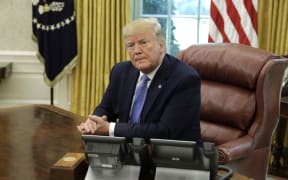 US President Donald Trump listens during a meeting on the the opioid epidemic in the Oval Office at the White House in Washington, D.C., on June 25, 2019. | usage worldwide