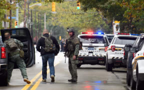 Police rapid response team members respond to the site of a mass shooting at the Tree of Life Synagogue in the Squirrel Hill neighborhood in Pittsburgh, Pennsylvania.