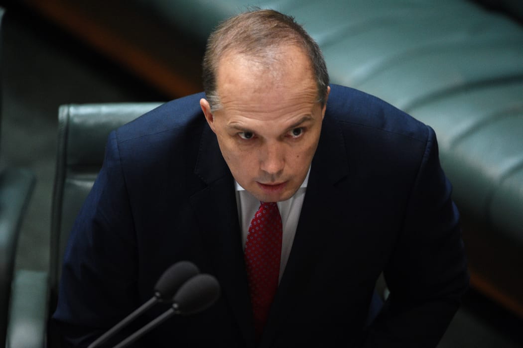 Immigration Minister Peter Dutton presents the Australian Citizenship Amendment (Allegiance to Australia) Bill 2015 in the House of Representatives at Parliament in Canberra on 24 June 2015.