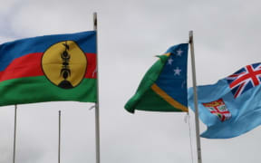 New Caledonia flag, left, flying at the 22nd Melanesian Spearhead Group leaders meeting in Port Vila.