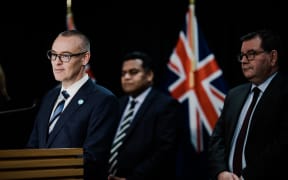 David Clark announcing his resignation as minister of health alongside Minister of Commerce and Consumer Affairs Kris Faafoi and Finance Minister Grant Robertson.