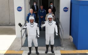 NASA astronauts Doug Hurley and Bob Behnken head to the SpaceX Falcon 9 rocket with the Crew Dragon spacecraft at the Kennedy Space Center. NASA will try again on Saturday for the inaugural flight that will be the first manned US soil-launched mission since 2011.