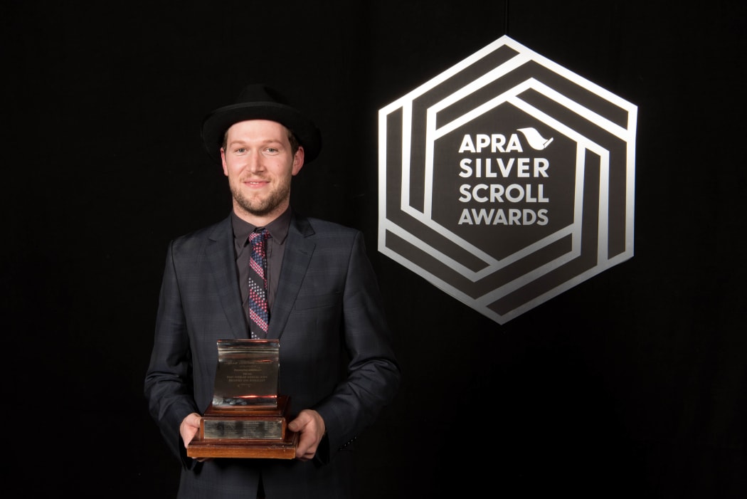 Thomas Oliver with his award, the 2016 Apra Silver Scroll