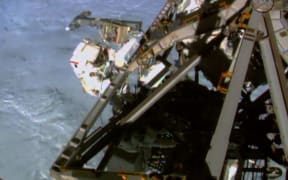 A NASA video image of Terry Virts working during a spacewalk on 1 March.