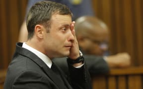 South African Paralympic athlete Oscar Pistorius cries in the dock during the verdict in his murder trial, Pretoria, South Africa, on September 11, 2014.
