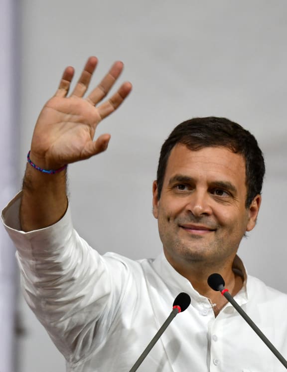 India's Congress Party President Rahul Gandhi waves as he attends a public rally in Mumbai