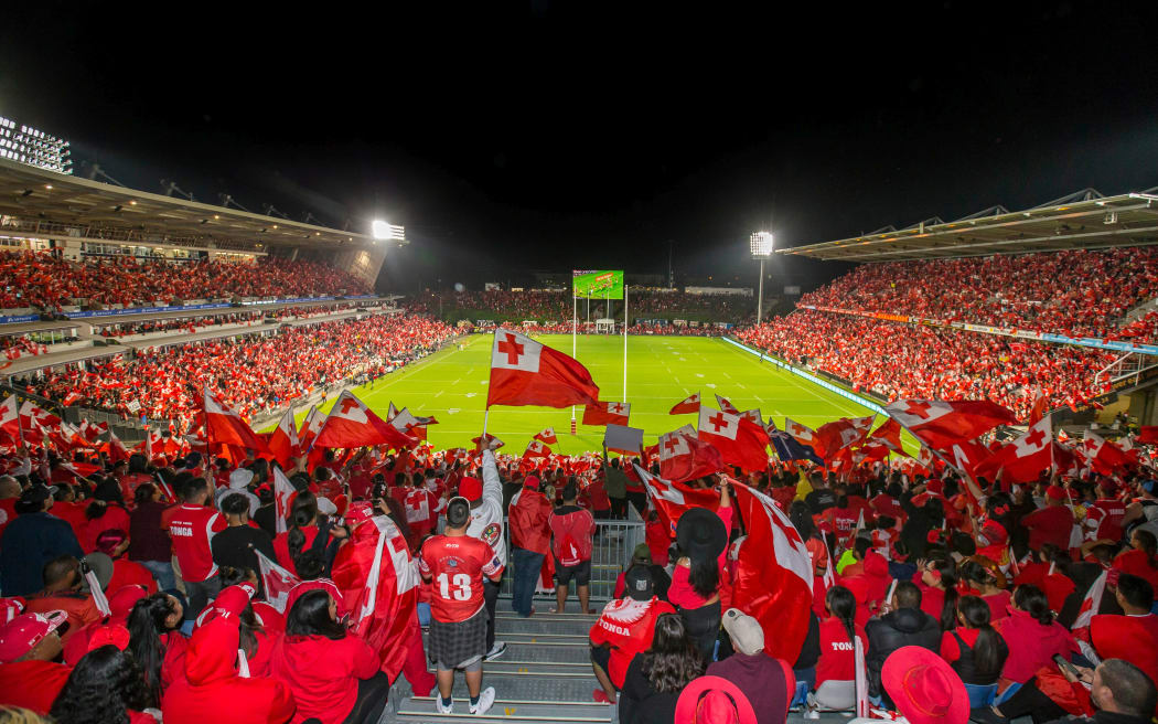 Tongan fans celebrate a try against Australia.