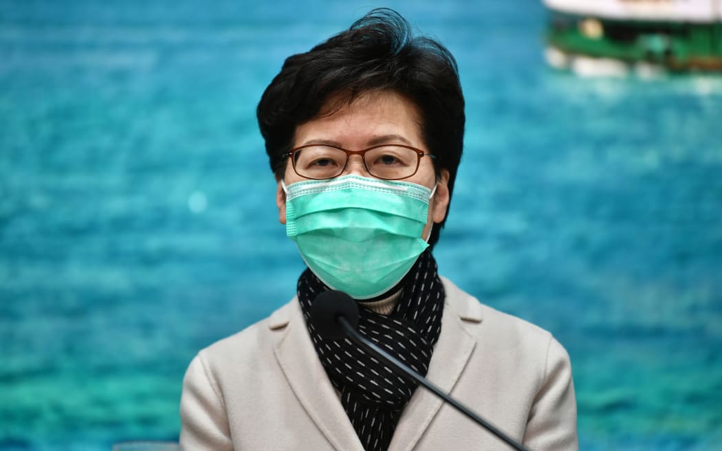 Hong Kong Chief Executive Carrie Lam announces travel restrictions.