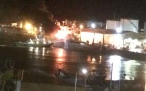Fire crews battling ablaze on board a fishing boat in Timaru port.