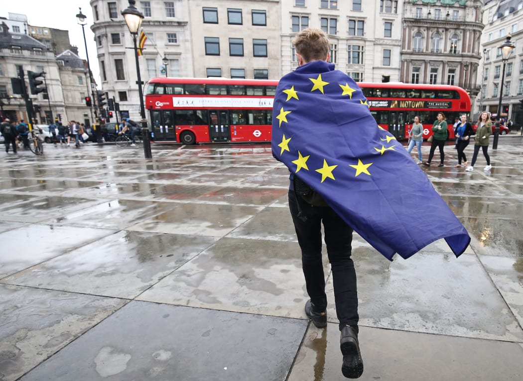 A demonstrator wrapped in a European flag leaves an anti-Brexit protest in Trafalgar Square in central London, 28 June 20016.