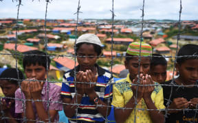Rohingya refugees at a ceremony to remember the first anniversary of a military crackdown that prompted a massive exodus of people from Myanmar to Bangladesh, on August 25, 2018.