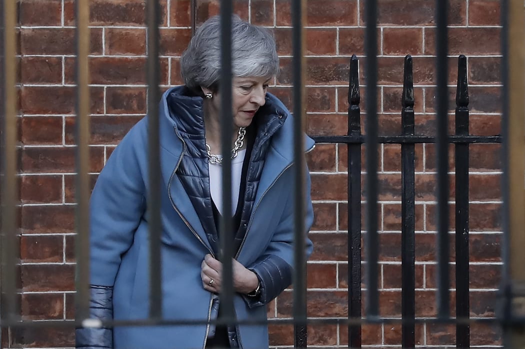 Britain's Prime Minister Theresa May leaves from the rear of 10 Downing Street in London on February 14, 2019 ahead of a vote on amendments to the Brexit withdrawal bill. (Photo by Tolga AKMEN / AFP)