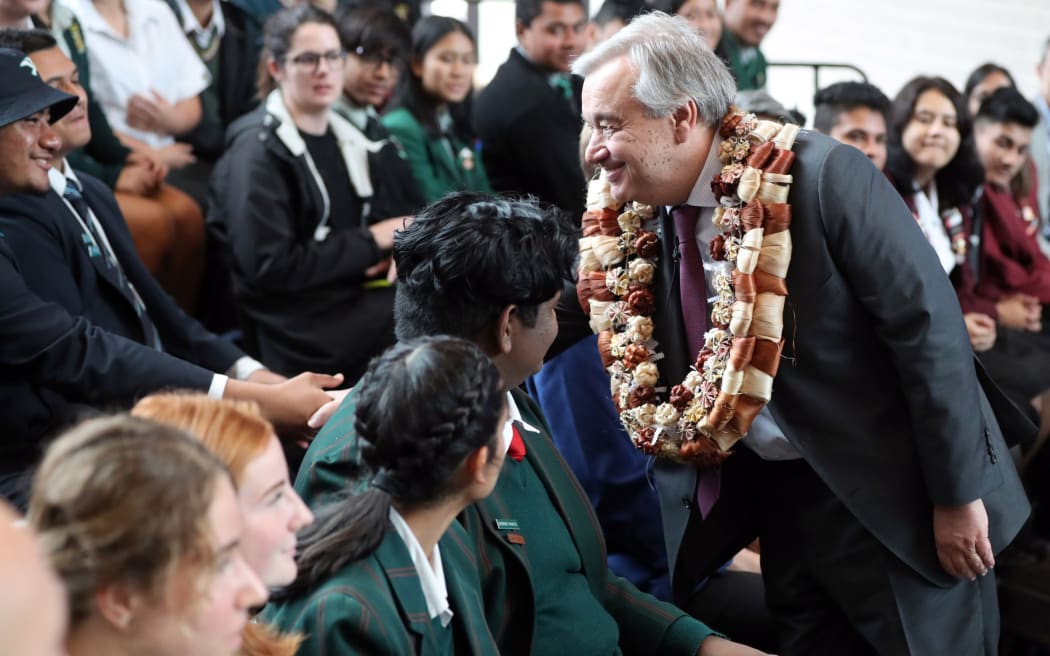 United Nations Secretary-General Antonio Guterres (R) meets students after giving a speech at the Auckland University of Technology (AUT) South Campus