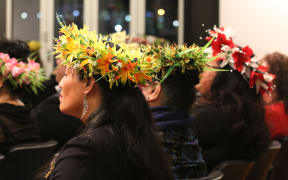 Women wearing head ei at a Cook Islands Constitution day reception in Wellington.