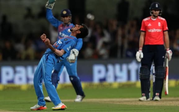 Yuzvendra Chahal celebrates the wicket of England batsman Joe Root.