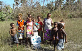 Children getting water on Hui in Torres.