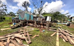 A photo taken on Saturday by the Red Cross of damage to a house on Vanua Levu, after the cyclone moved south.