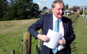 Housing and Building Minister Nick Smith at the Massey East parcel of Crown land identified for housing in Auckland.
