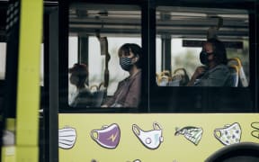Bus passengers wearing masks during level 2, Wellington 15 February 2021