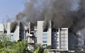 Smoke rises after a fire broke out at India's Serum Institute in Pune on January 21, 2021.