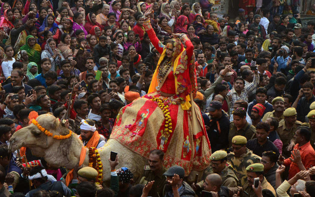 Laxmi Narayan Tripathi, head of Kinner (eunuch) Akhara, takes part in a religious royal entry procession called 'Peshwai' for Ardh Kumh Mela.