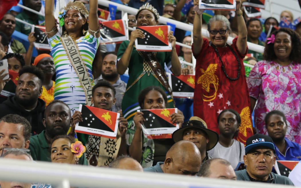 Spot the celebrity-spectators cheer as team Papua New Guinea make their entrance at the 2023 Pacific Games opening. 19 November 23