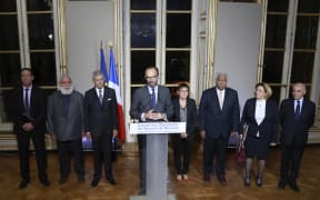 French Prime Minister Edouard Philippe (C), flanked by members of the Noumea Accord Signing Committee (Comite des Signataires.