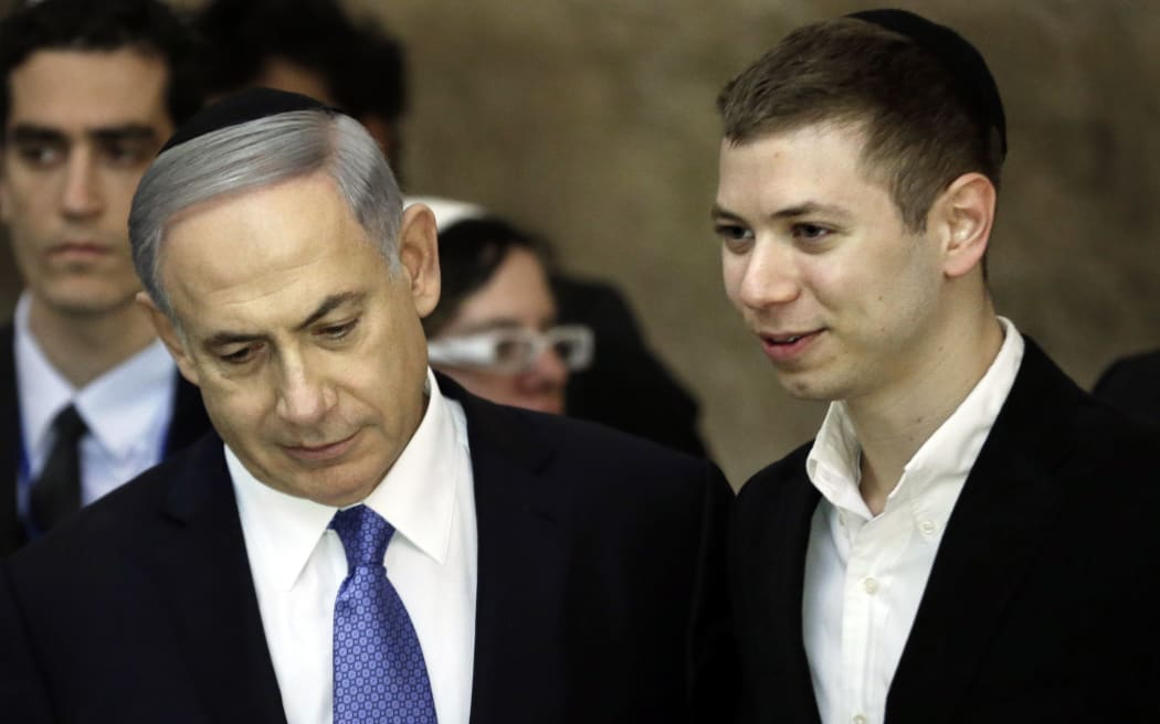Israeli Prime Minister Benjamin Netanyahu (L) and his son Yair.