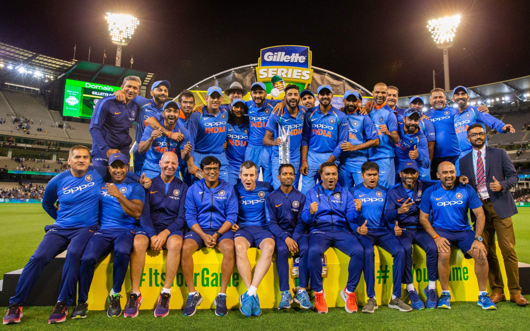The victorious Indian cricket team with trophy