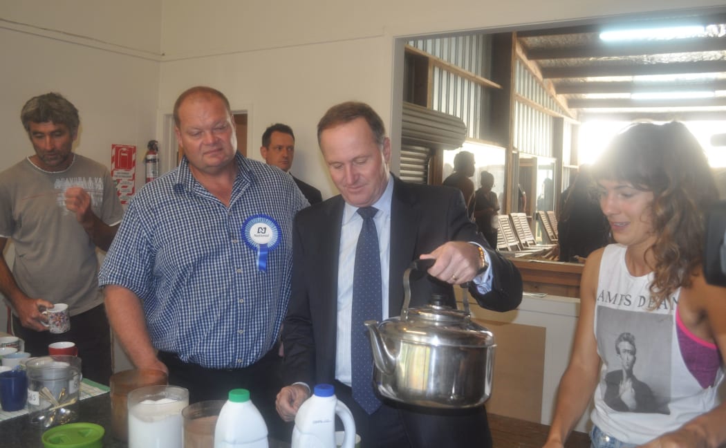 John Key and Mark Osborne visiting a Kerikeri kiwifruit packhouse on the final day of campaigning in the Northland by-election.