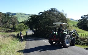 Farmers out clearing the road on Kahuranaki Road in Tukituki Valley, Hawke's Bay.
