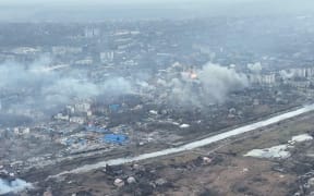 This video grab taken from a shooting by AFPTV shows an aerial view of destructions during fighting in the city of Bakhmut on 27 February 2023.
