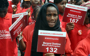 Children take part in a demonstration in Abuja on 14 April, marking one year since the abduction of 219 schoolgirls.