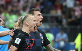 Croatia's Domagoj Vida celebrates with Mario Mandzukic after the FIFA World Cup Semi Final match between England and Croatia.