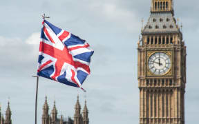 A Union Flag against the backdrop of British Parliament's Big Ben.