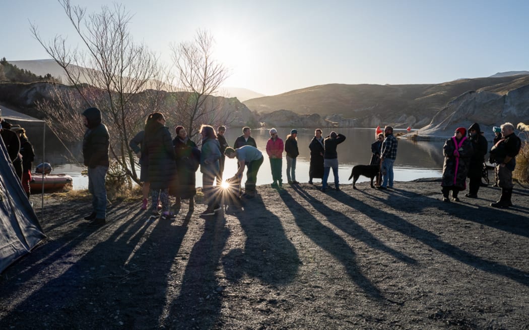 Athletes at the New Zealand ice swimming championships prepare to plunge into Otago's Blue Lake near St Bathans.