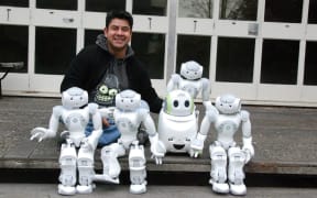 Eduardo Sandoval and some of the University of Canterbury’s research robots.