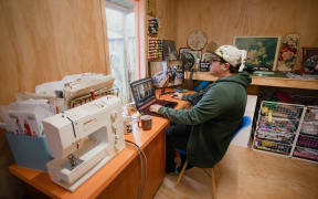 Claire Eastham-Farrelly working from her partner's sewing shed during the Covid-19 lockdown.