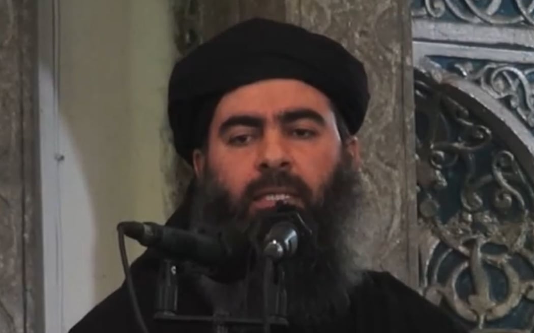 An image grab taken from a propaganda video released on July 5, 2014 by al-Furqan Media allegedly shows the Islamic State leader Abu Bakr al-Baghdadi adressing worshippers at a mosque in  Mosul. MANDATORY CREDIT "AFP PHOTO / HO / AL-FURQAN MEDIA "