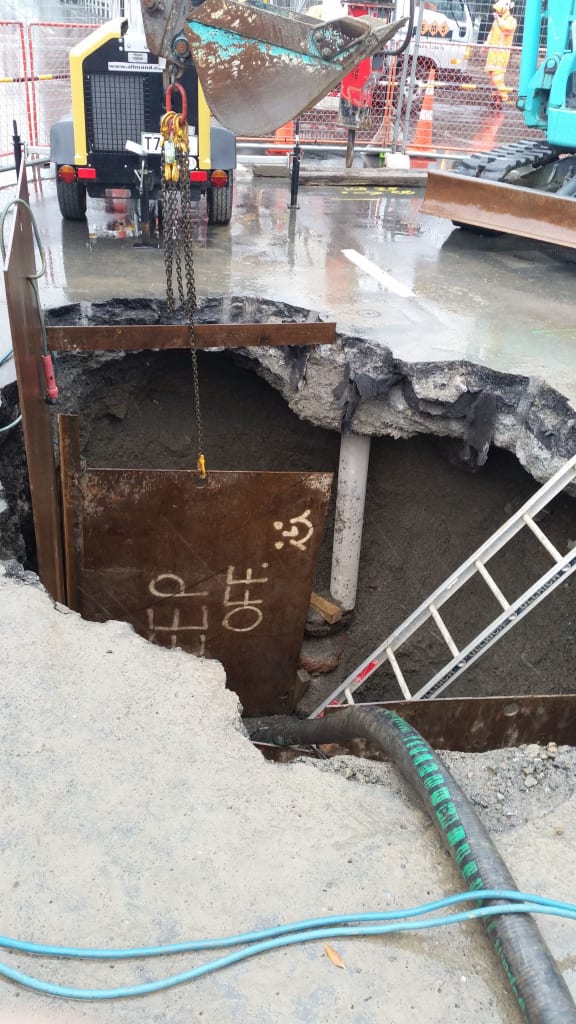 The access hole used to repair the crack in the pipe found by contractors.