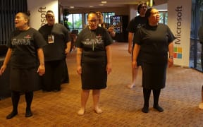 A kapahaka group welcome Whānau Ora manuwhiri at Te Pou Matakana conference.