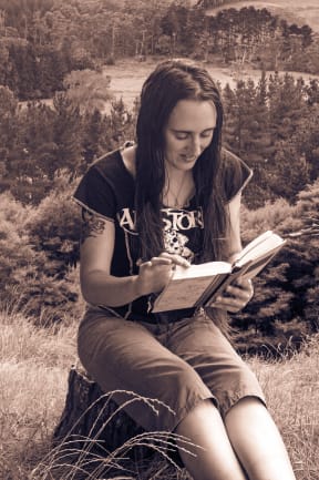 a successful self-published author of dark fantasy and paranormal romance