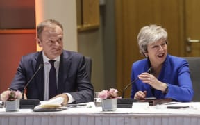 European Council President Donald Tusk (L) and Britain's Prime Minister Theresa May look on during a European Council meeting on Brexit at The Europa Building at The European Parliament in Brussels on April 10, 2019.