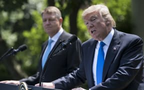 US President Donald Trump at a media conference in the Rose Garden of the White House with the visiting  president of Romania Klaus Iohannis.