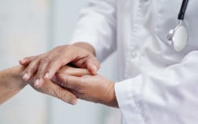 Holding Touching hands senior or elderly old lady woman patient with love, care, helping, encourage and empathy at nursing hospital ward : healthy strong medical concept